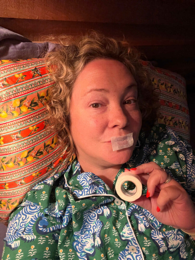 Charles Perri in Printfresh pajamas with a piece of medical tape over her lips