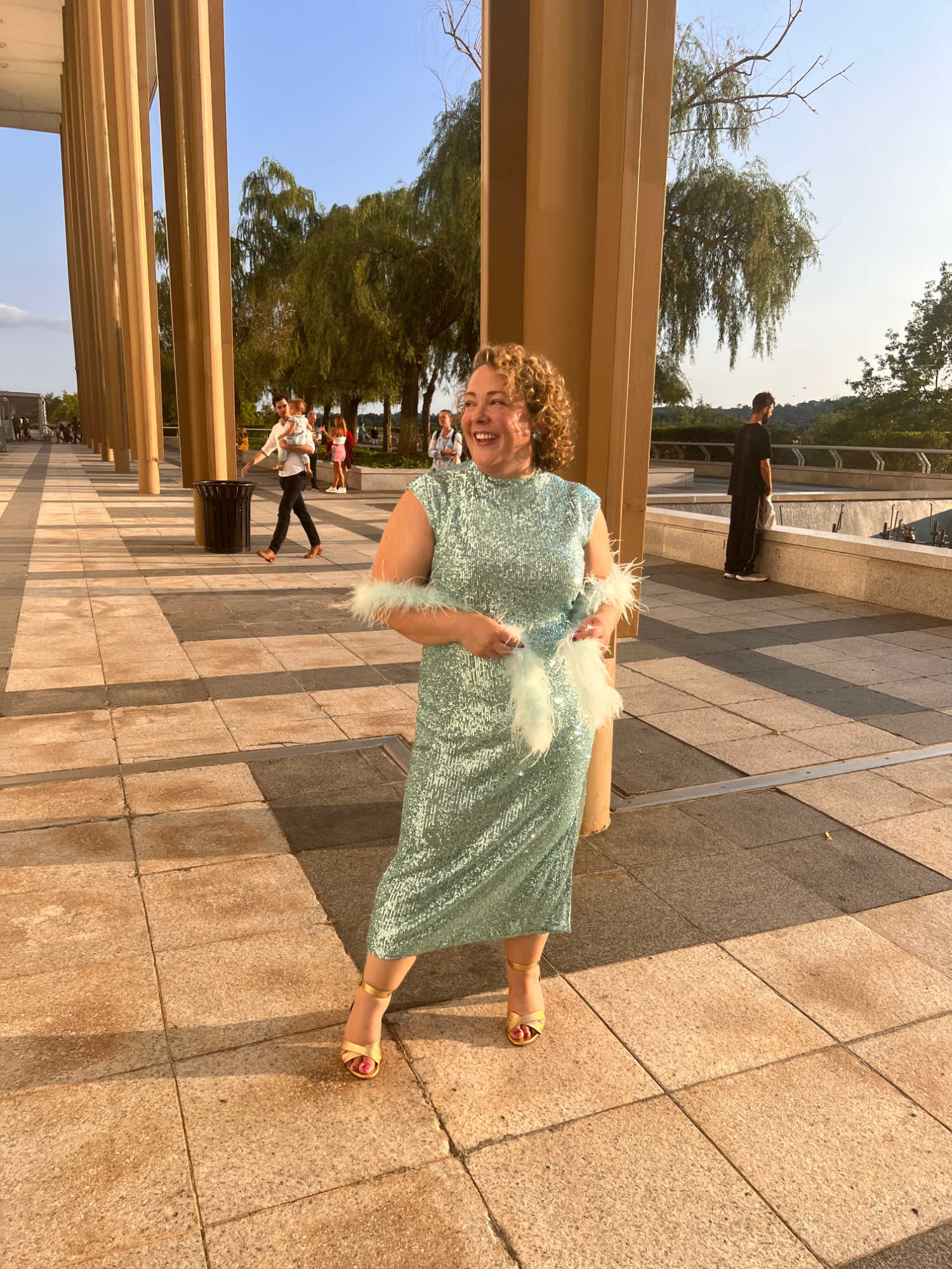 Charles Perri of Wardrobe Oxygen wearing an aquamarine sequined cocktail dress from Ann Taylor at the Kennedy Center in Washington DC.