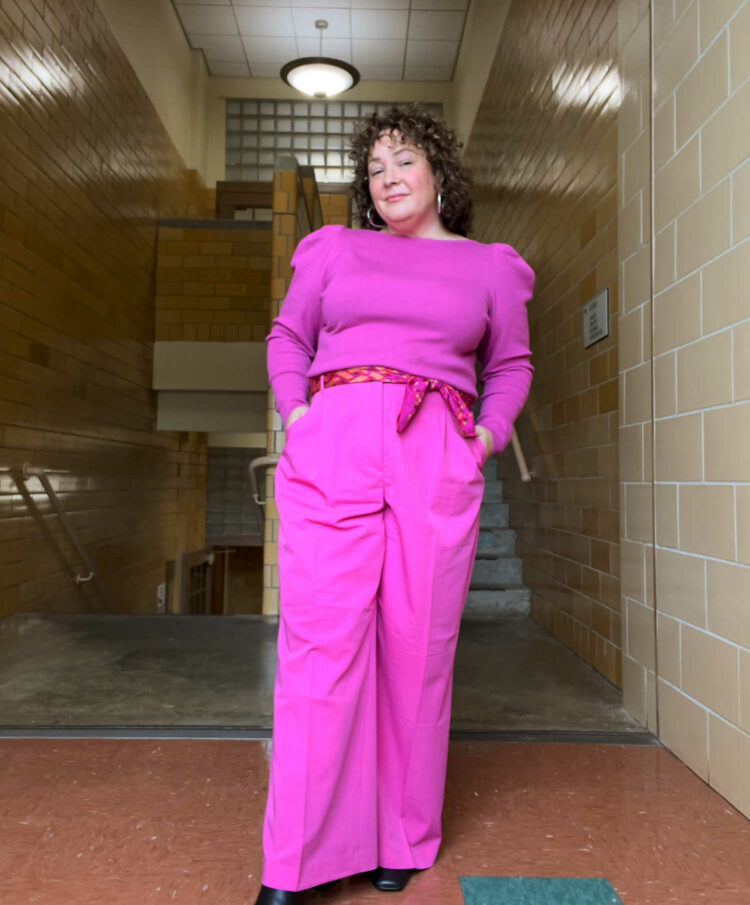 Charles Perri of Wardrobe Oxygen in a pink puff sleeve sweater and matching trousers from Ann Taylor