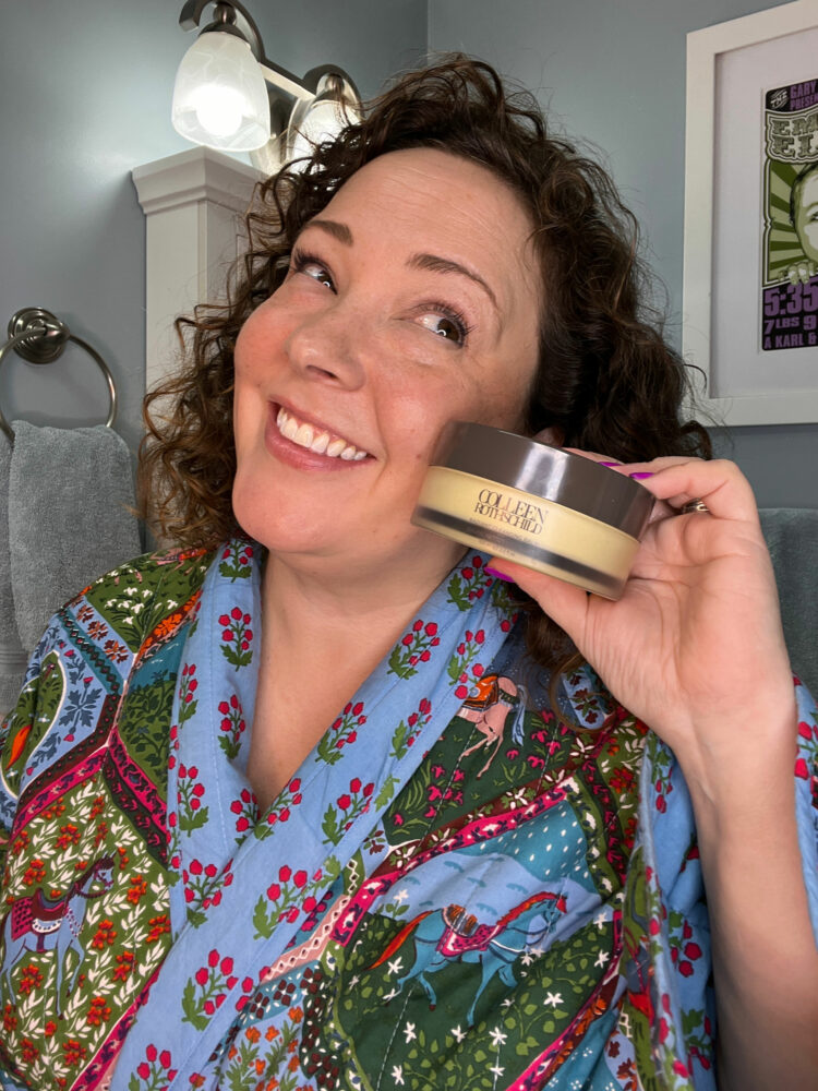 Alison holding a jar of Colleen Rothschild radiant cleansing balm while wearing a quilted Printfresh robe